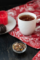 A tasty break: a cup of tea and a glazed zefir.