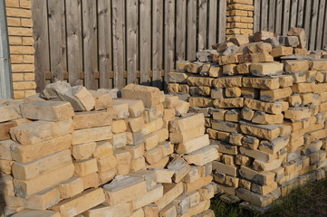 Heap of bricks for the fence on the street