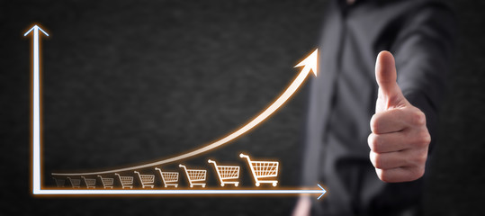 Shopping cart and growth graph. Increase in sales