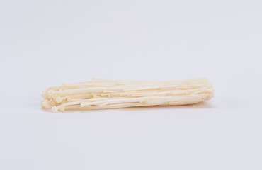 Enokitake or enoki (Flammulina velutipes) white mushroom and also known by the name golden needle mushroom or lily mushroom