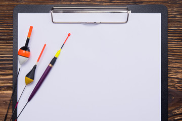 on a dark wooden background, close-up of the tablet with a clean sheet for recording, and objects...