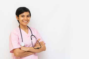 Asian female doctor with shot black hair wearing pink uniform and has stethoscope on shoulder. Confident and warmth looks isolated in white background. Space for text