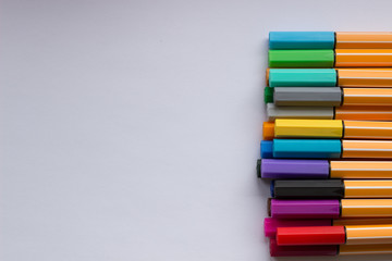 Set of colorful pens on white background