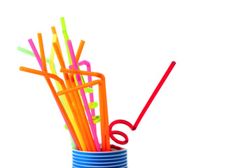 Colored plastic tubes in blue glass