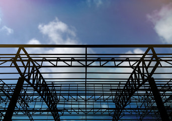 Steel constructions silhouette, blue sky in back ground.