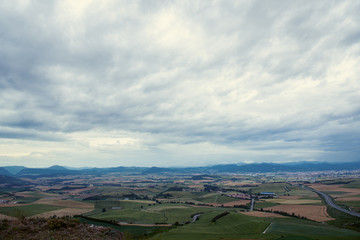 Obraz premium Spanish landscape with fields, sky and mountains, Navarra, Spain