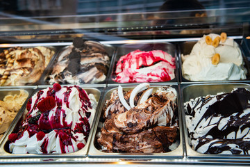 Ice cream in Rome, Italy. Italian gelateria. Ice-cream cafe, show window with sweeties.