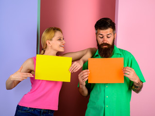 Surprised couple holding advertising board. Advertising. Sale. Online shopping. Advertising banner. Seasons sale. Discount. Marketing. Add. Copy space for text.