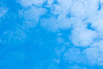 white cirrocumulus clouds on blue sky