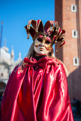 Fototapeta na wymiar Carnival of Venice. Colorful carnival mask at a traditional festival in Venice, Italy. Beautiful mask at masquerade in Piazza San Marco