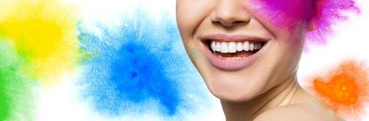 Laughing woman with great teeth with hand drawn multicolored watercolor elements and copy space for text message over white background. Healthy beautiful female smile.