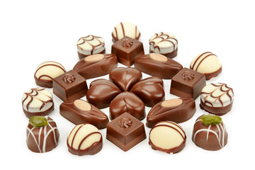 Chocolate candies isolated on white background. Flat lay, top view.