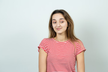 Obraz premium Emotional portrait of a fair-haired girl on a gray background, stormy emotions, business concept. 