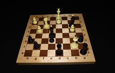Chechered board and black pawns as a skill concept