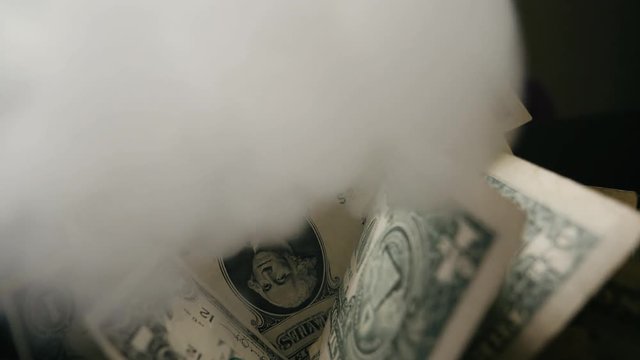 Smoke Over Dollar bills in a box, money background. Dollars money set Slow With Shallow Dof and smoke. Dollars, money close up.