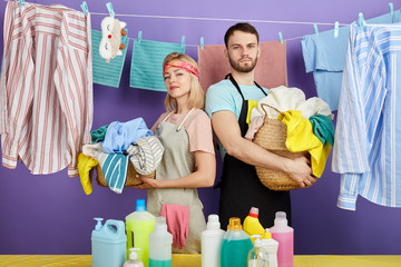 awesome young couple doing laundry at home. close up photo. weekesnd, day off, spare time