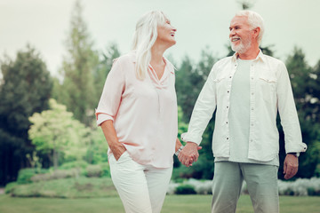 Happy delighted couple having a great time together