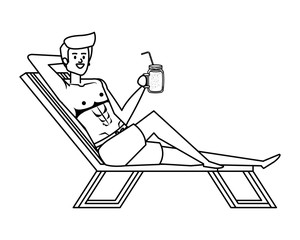 young man relaxing in beach chair drinking juice fruit