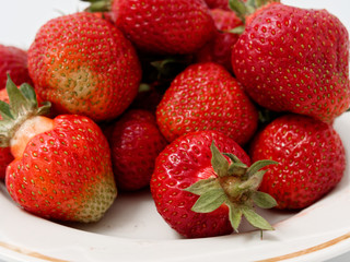 red ripe strawberry appetizing berry on a white background