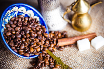 Fresh coffee in cezve on wooden table