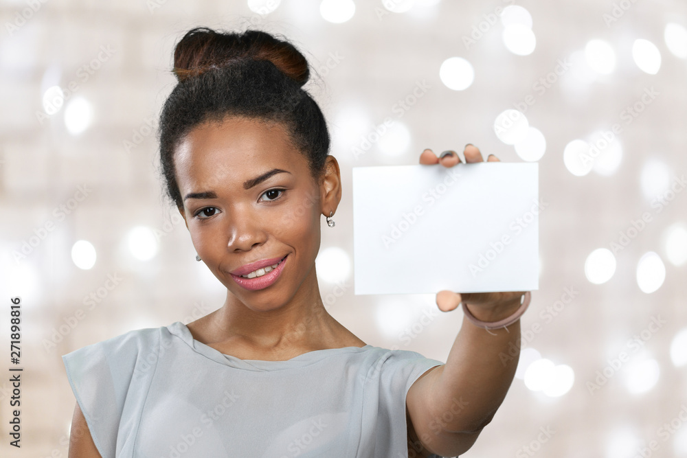 Wall mural African american woman holding blank paper