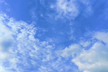 Beautiful view of white fluffy clouds on a clear blue sky background. Nature weather on the vast cloud blue sky. Sky daylight in summer. Natural background with copy space. Element of design.