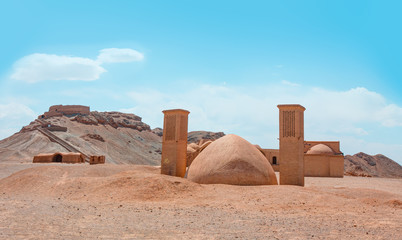 Towers of silence at bright blue sky - Yazd, Iran - The historical site of ancient Persia