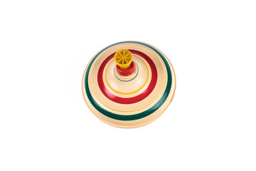 Vintage toy top spinning in motion on a white background