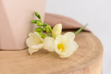 Beautiful freesia flowers on wooden table