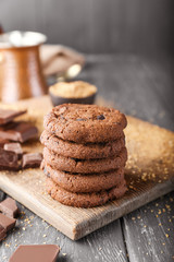Tasty chocolate cookies on wooden table