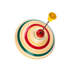 Vintage toy top spinning in motion on a white background
