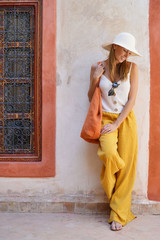 Elegant stylish woman smiling in Moroccan riad