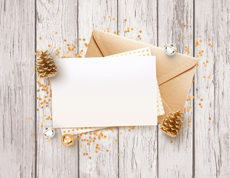 Blank paper, rose gold envelope mockup design template with brown wooden table and Christmas decoration