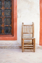 Ornate moroccan window in riad courtyard