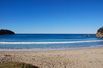 Seascape with blue sky. Nobody on the beach. Tranquil scenery in Australia.