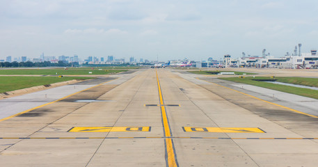 Panorama of airplanes on taxiway in airport. Path for aircraft transfer to and from runway.