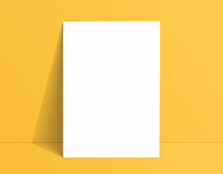 White poster mockup standing on the floor near yellow wall. Blank Canvas Mockup for design