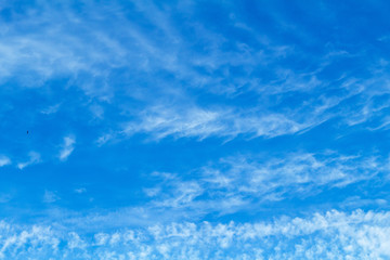 Blue sky with picturesque fluffy clouds background