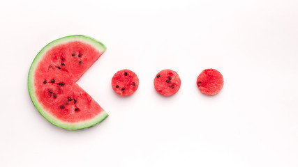 Watermelon Pacman eating small red round pieces