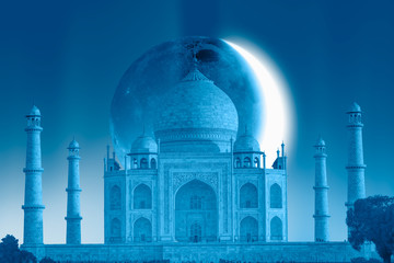 Taj Mahal with crescent moon at night - Agra, India 