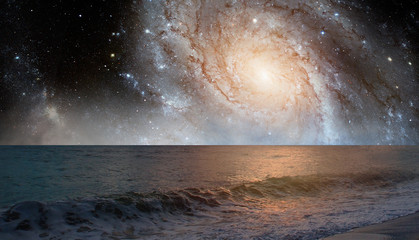 Milky Way Galaxy over the sea with sunset reflection on the sea 