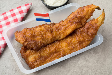  Fried fish fillet, called lekkerbek in Dutch served with sauce and lemon
