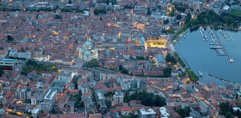 Como - The city with the Cathedral and lake Como at dusk.