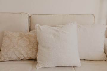 beige sofa with pillows in living room