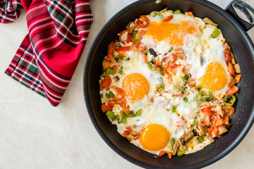 Fried Eggs with Vegetables in Pan Cooking