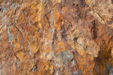 Rusty materials on stones 10
