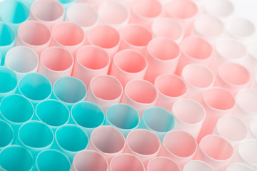 Abstract colorful background. Background from cocktail tubes close up. Soft focus. Cocktail tubes of different colors close up.Close-up of straw tubes.