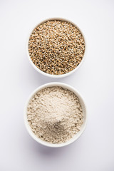 Bajra (pearl millet) / sorghum grains with it's flour or powder in a bowl, selective focus