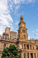 The beautiful Town Hall of Sydney, Australia, against the blue sky with some clouds