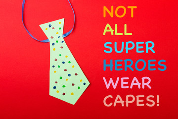 Happy fathers day sign on paper  laid on red  backround.